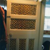 The door to a Zimbabwe themed cloakroom