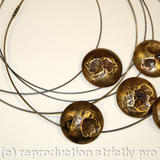 collection of earth from air brass domed pendants on oxidised silver cables