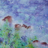 Bluebells and spurge appear to touch the ocean