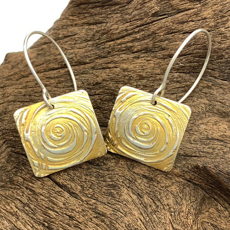 SOLD. Swirl Patterned 24ct Highlighted Silver earrings