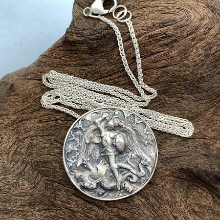 Archangel Michael slaying a dragon silver pendant
