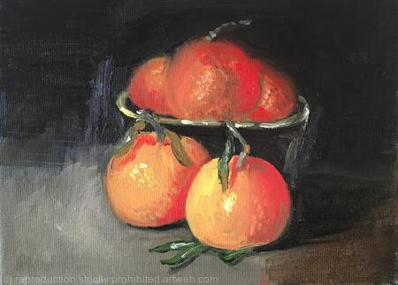 Clementines and a black clay bowl